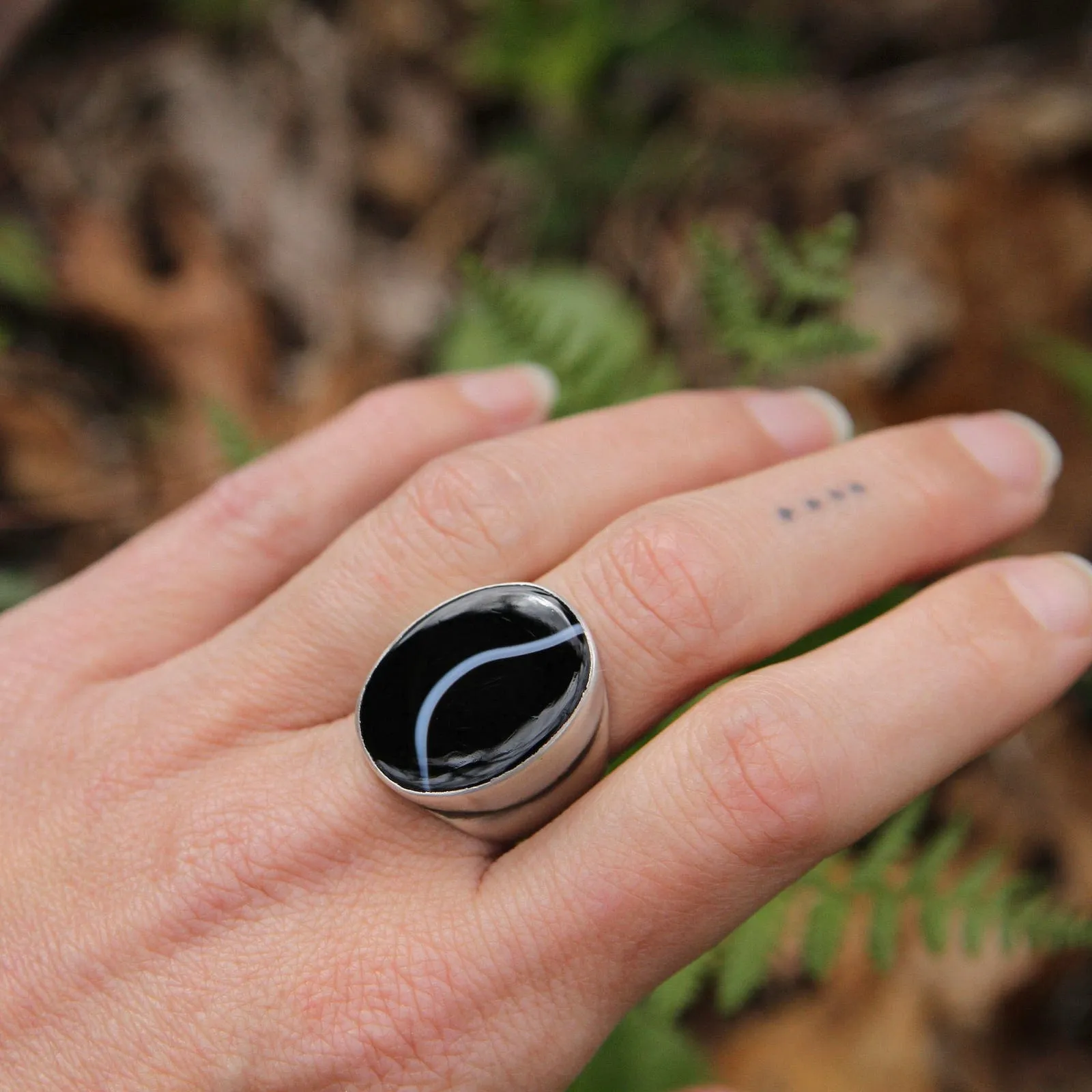 Large Oval Flat Cut Banded Black Onyx Ring