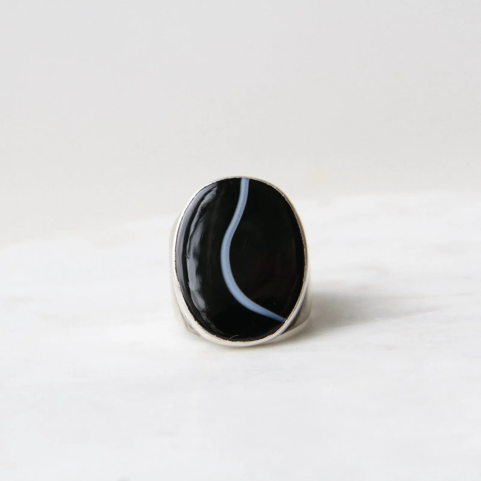 Large Oval Flat Cut Banded Black Onyx Ring