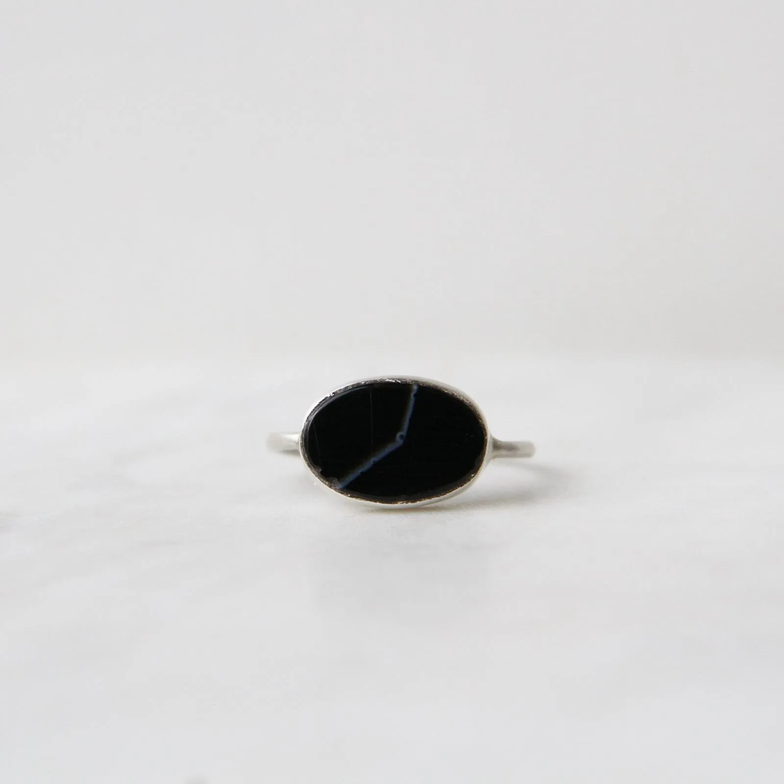 Oval Flat Cut Banded Black Onyx in Sterling Silver Ring